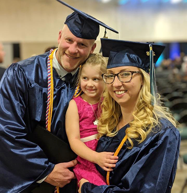Graduates Bridget and Michael Novak and their daughter at the NWTC 2018 graduation ceremony.