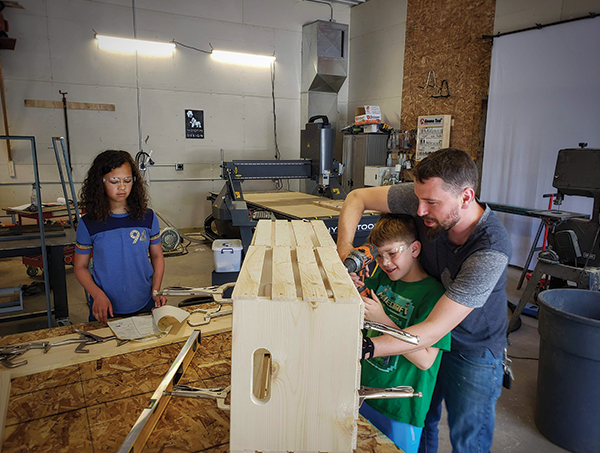 Gerarden, pictured working on a lemonade stand with his son, was recently named one of Woodworking Network Magazine’s 40 under 40 award winners.