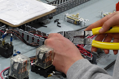 A student works on a circuit board