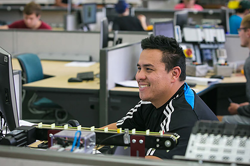 A student works on a computer in the automation lab