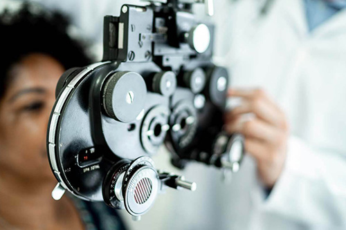 An eye doctor examines a patients eyesight