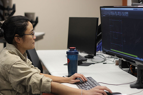 A student drafts a model on a computer