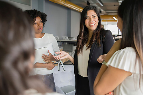 A businesswoman works with her employees