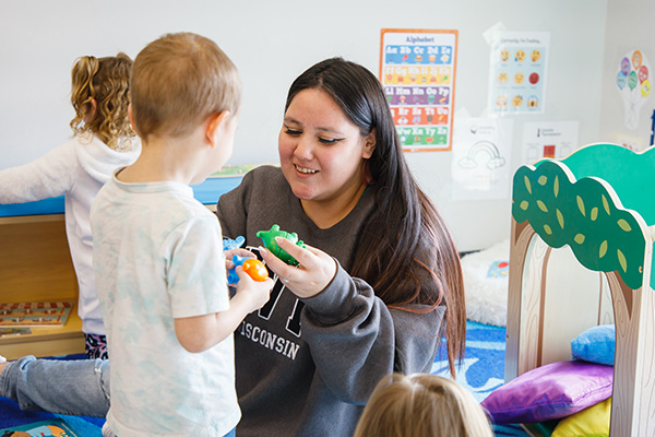 An instructor demonstrates a teaching method to her students