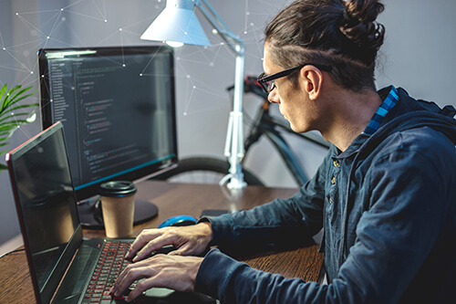 A student concentrates while programming