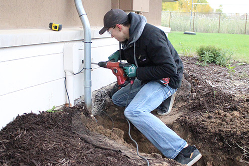 An electrician runs power to a new home