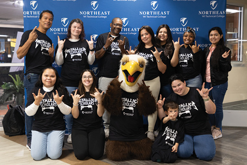 Metallica Scholars pose with the NWTC Eagle