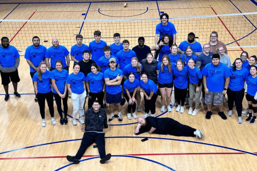 NWTC students posed in front of volleyball net
