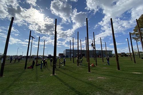 Students climb utility poles at Utility Preview Day