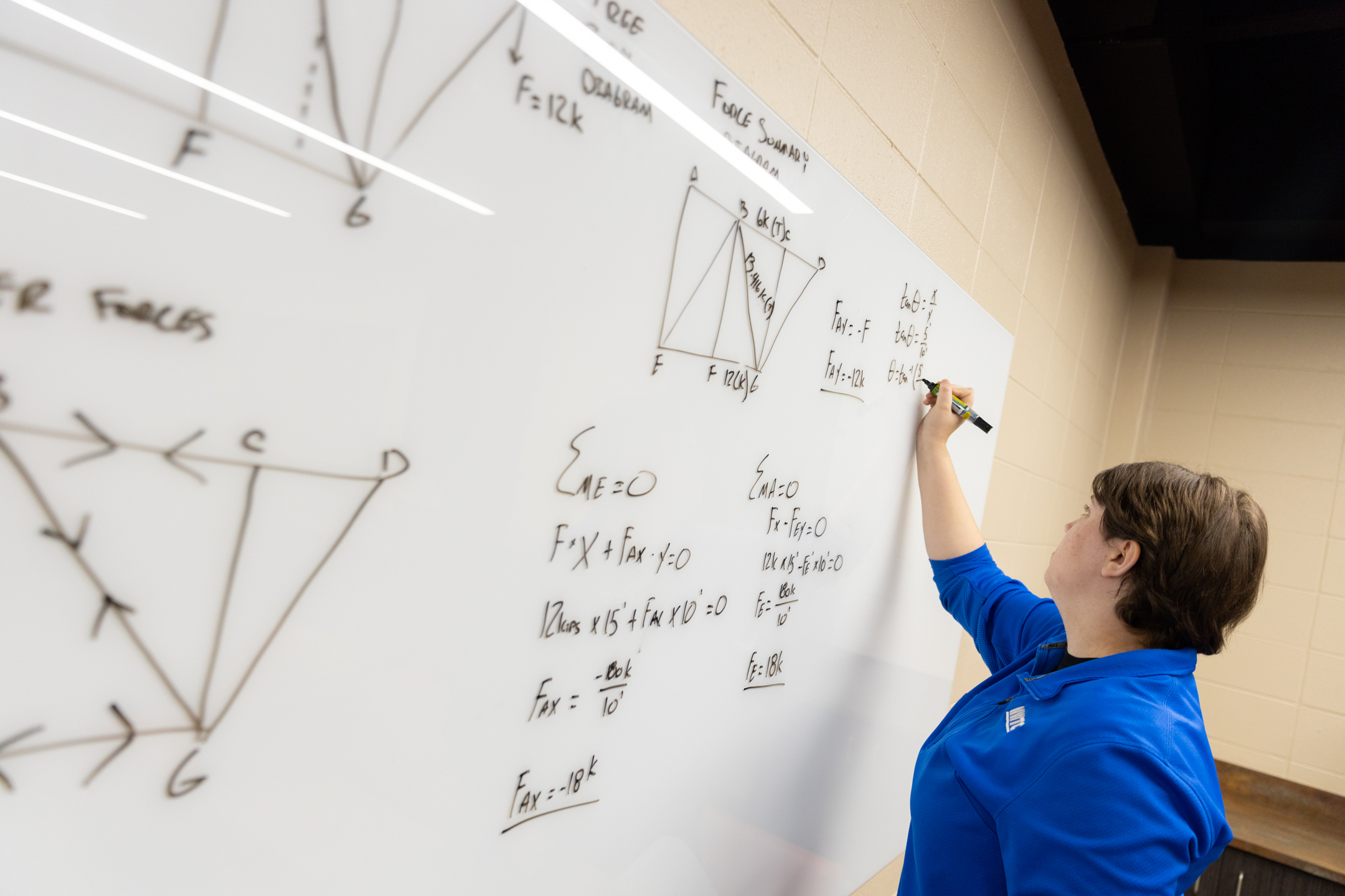 NWTC Mechanical Design student draws out force diagrams