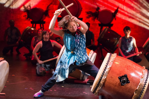 A drummer from Taiko Arts Midwest posed with drum