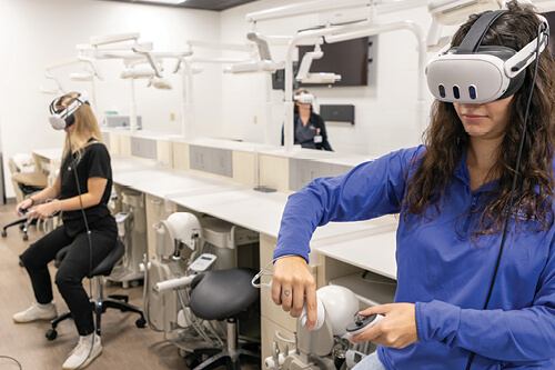 Students participate in simulations in the Dental VR lab