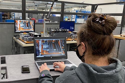 Engineering student working on computer in lab