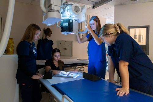 Radiography students using equipment