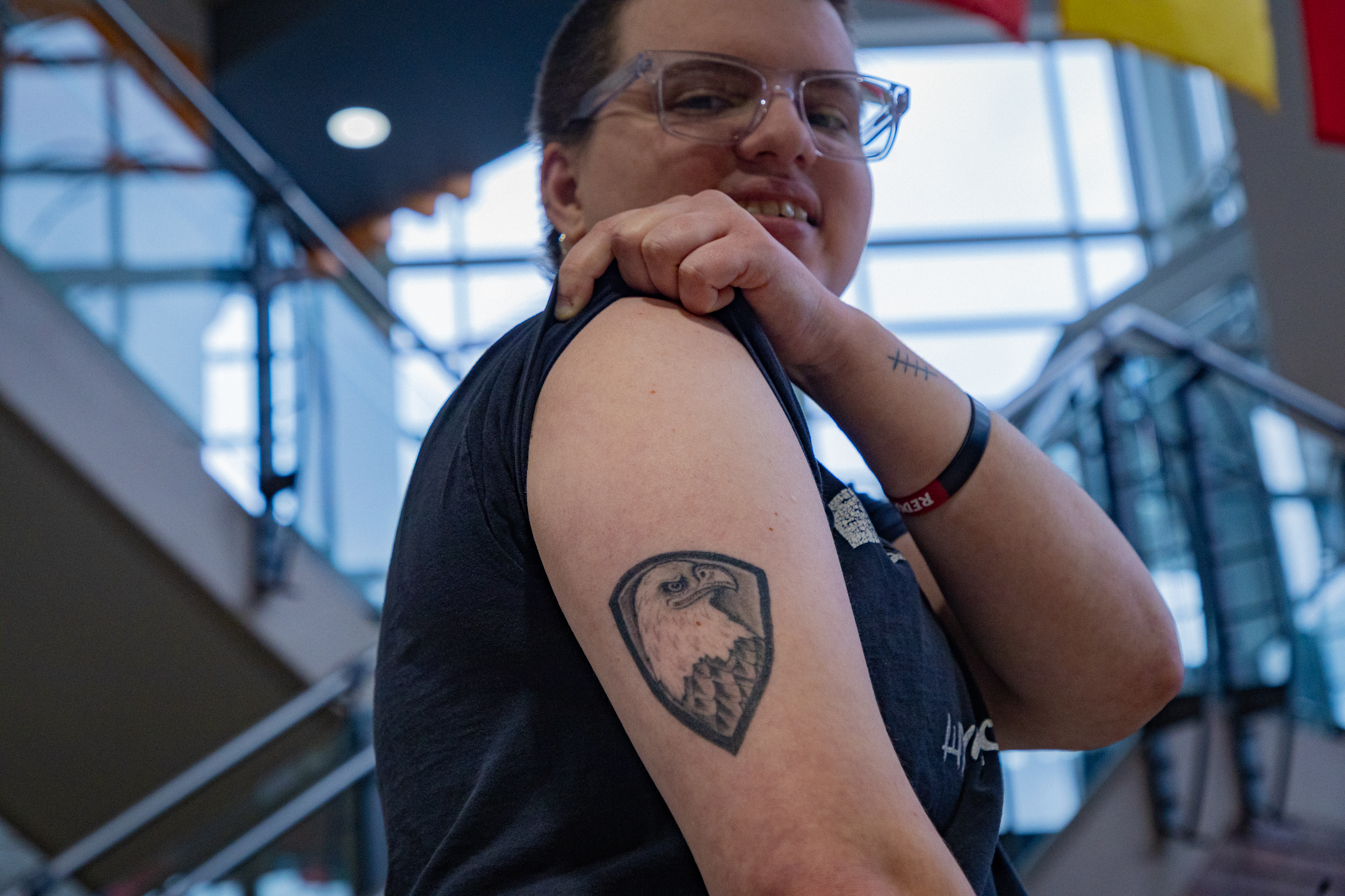 Eli Yavtushenko rolls up sleeve to show eagle tattoo