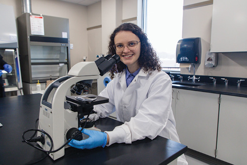 An NWTC student uses a microscope