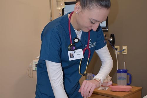 Nursing student Sarah Petit checks patient pulse