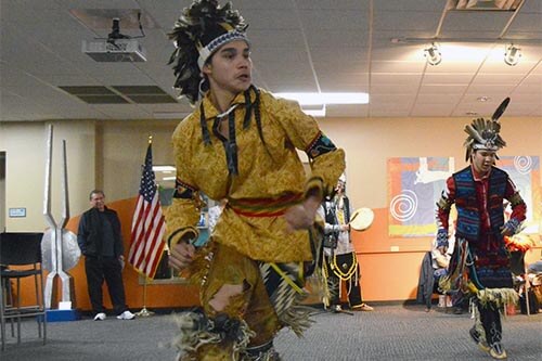 Native American dancers in traditional costumes