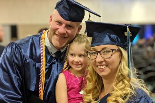 NWTC graduates Michael and Bridget Novak pose with their daughter