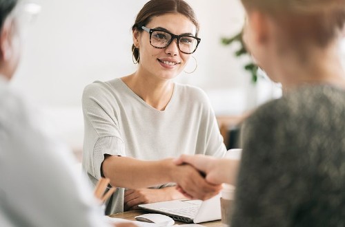 Business professionals connecting in person