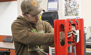 A male student works in a metals lab