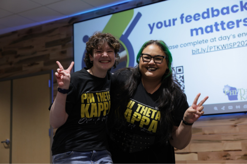 Two members of Phi Theta Kappa posing for photo