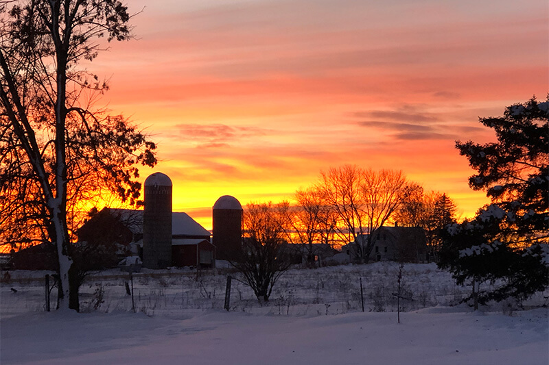 sunrise over a farm