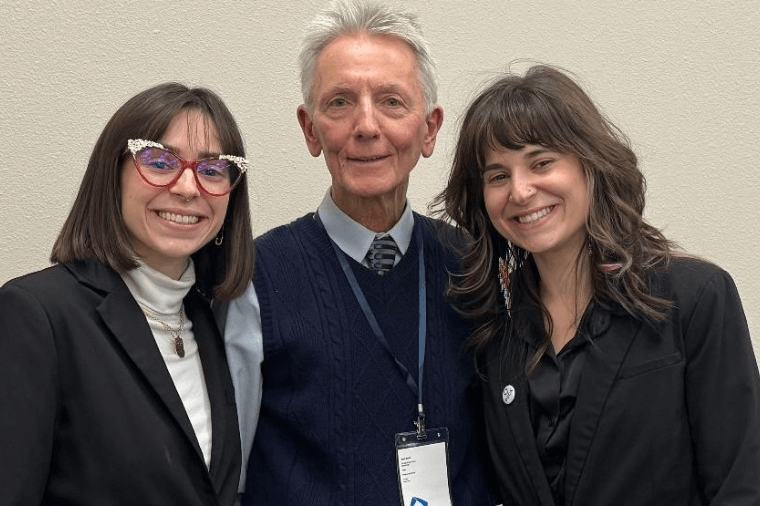 Jerry Lintz standing with two former students, Amanda and Alison Miceli
