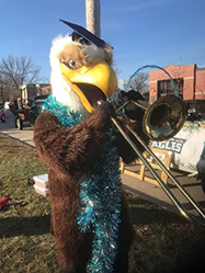 Eagle playing a trombone.