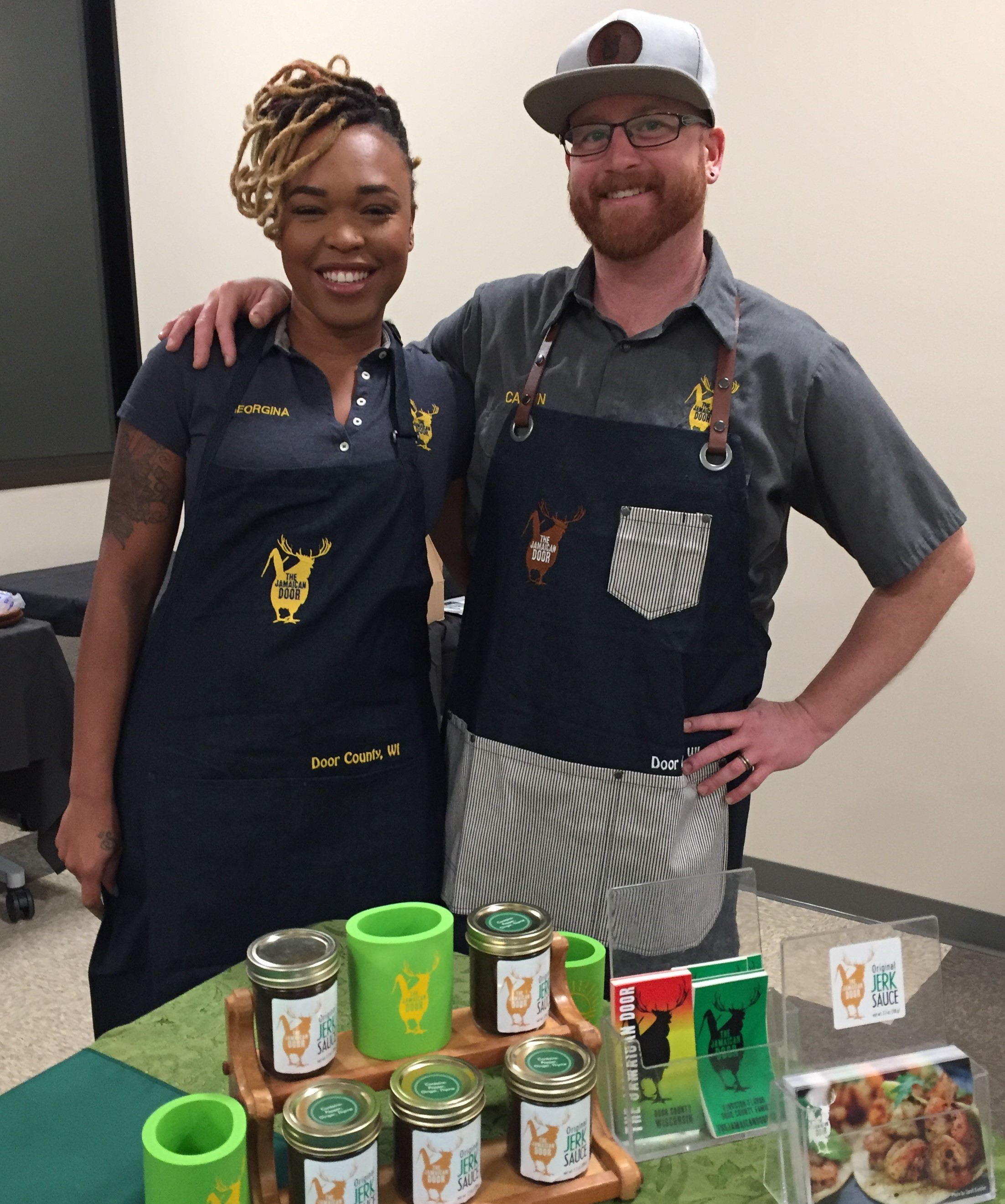 Two kitchen students pose with their product