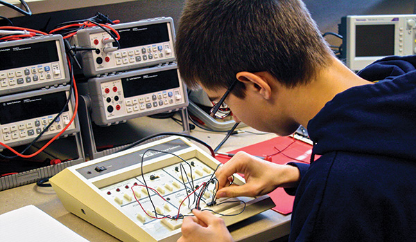 Crivitz student works on an electrical panel