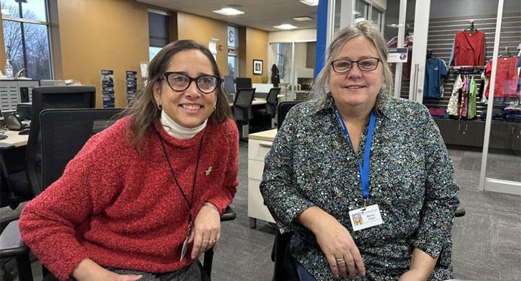 Two Sturgeon Bay staff members pose with smiles