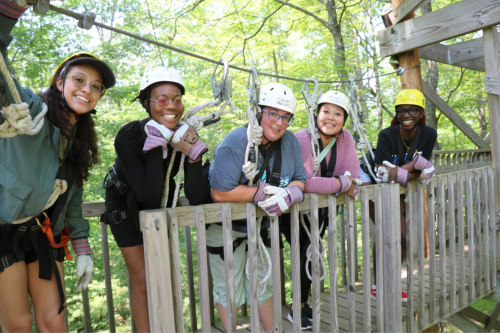 Students on a bridge for zipline