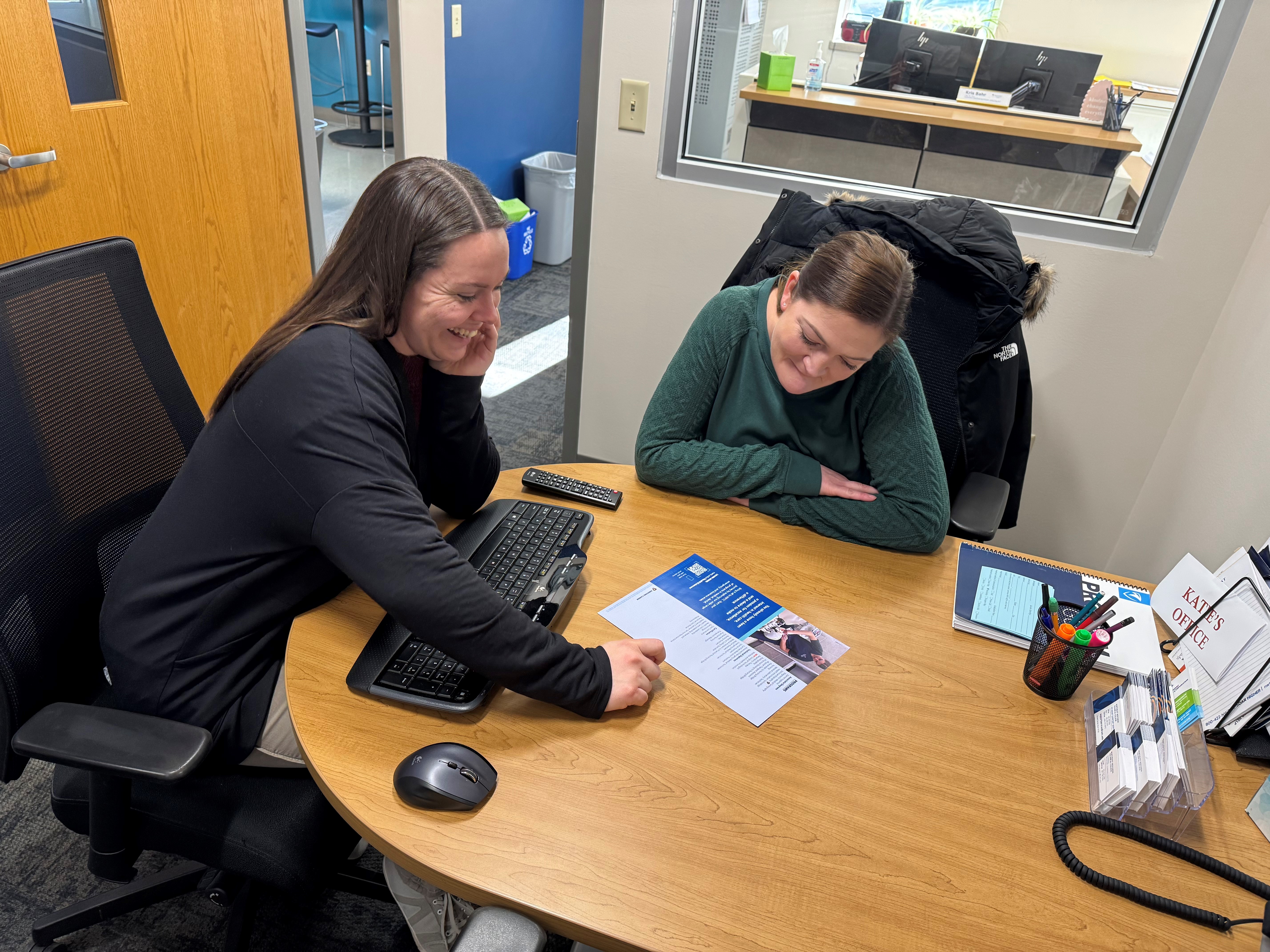 NWTC staff sitting with student