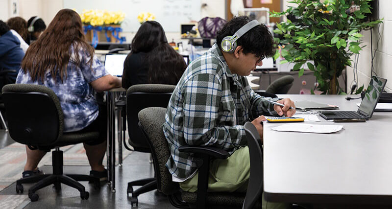 Students study at laptops