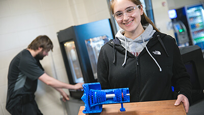 Student holding 3D printed item