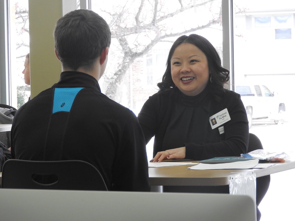 An academic coach works with a student