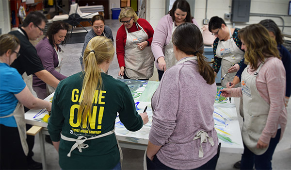 Group of people working on a collaborative art project