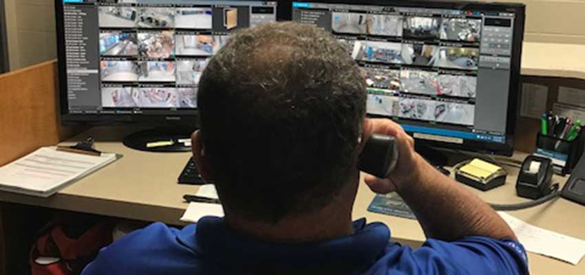 Security staff looking at camera footage