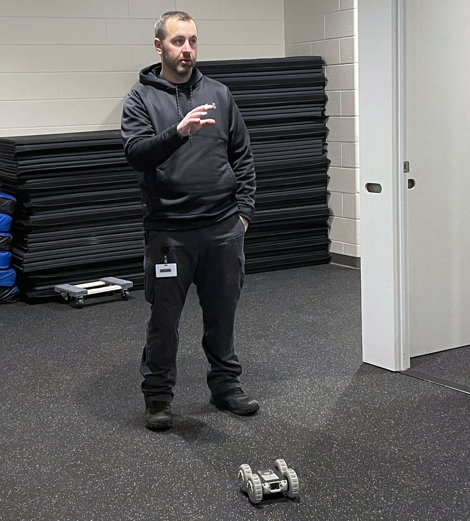 Instructor speaks with drone in foreground