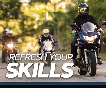 Two motorcyclists on road with refresh your skills text.