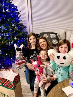 Mary Beth Boettcher sitting with three of her grandchildren