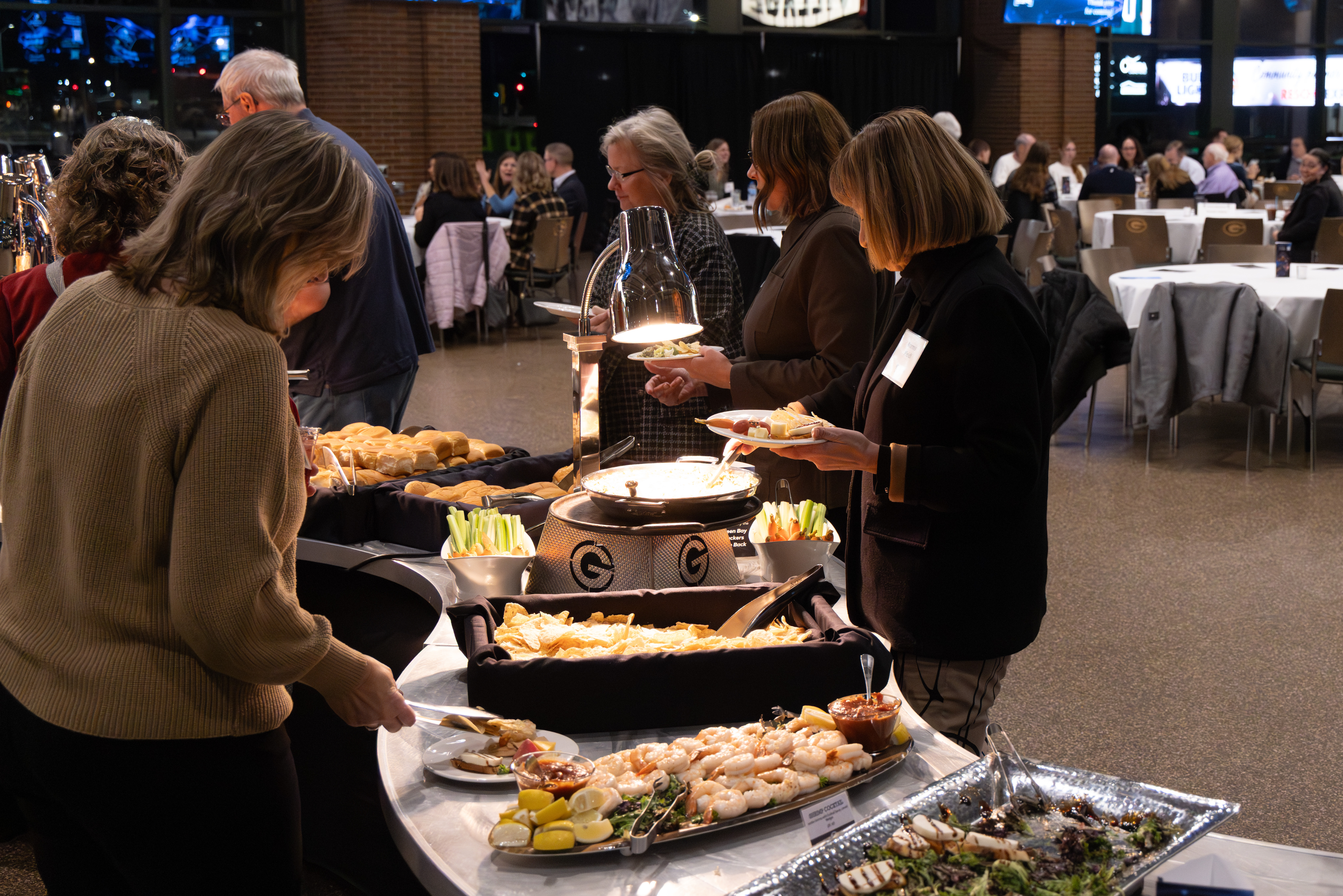 People take food from a buffet
