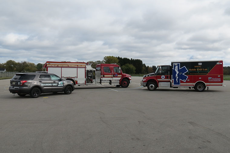 Emergency vehicles parked in lot