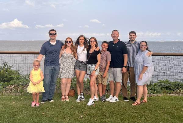 McIntosh family standing and facing camera