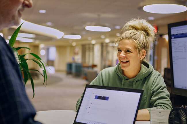 Smiling students have a conversation