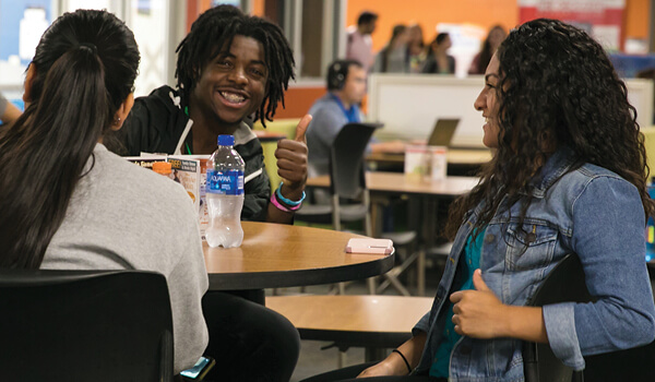 Students sit together in the commons