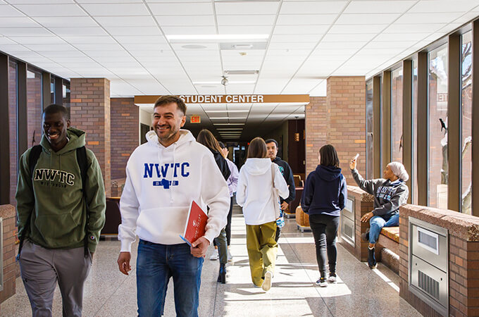 Recruiters jump beneath a welcome banner