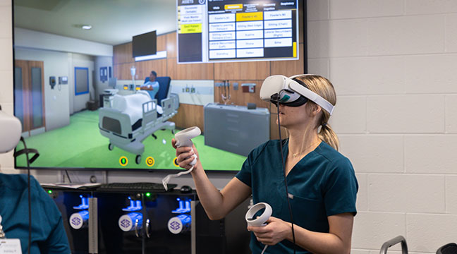 High school students learn about the phlebotomy program on a tour