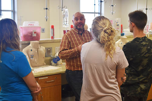 High school students learn about the phlebotomy program on a tour